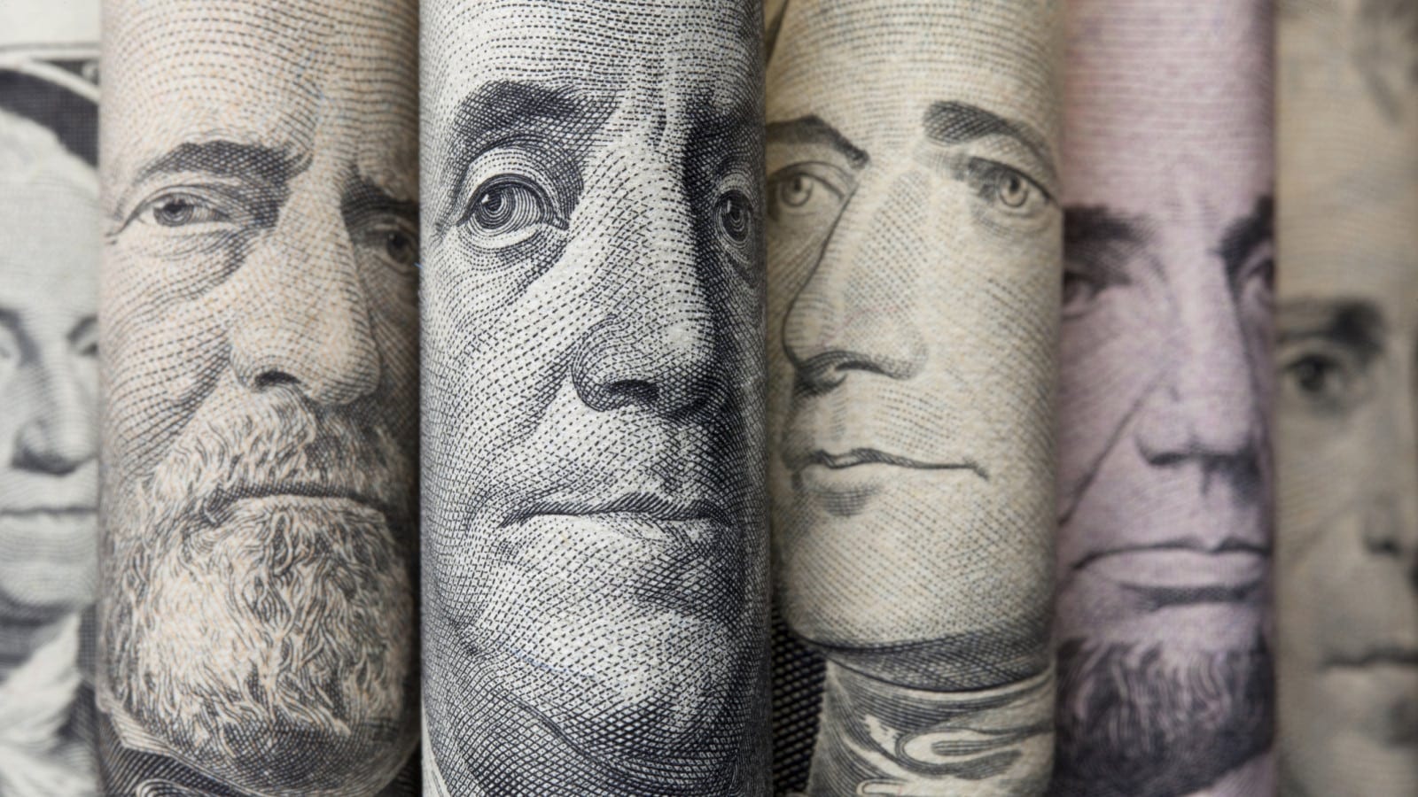 Portraits of U.S. presidents on dollar bills.