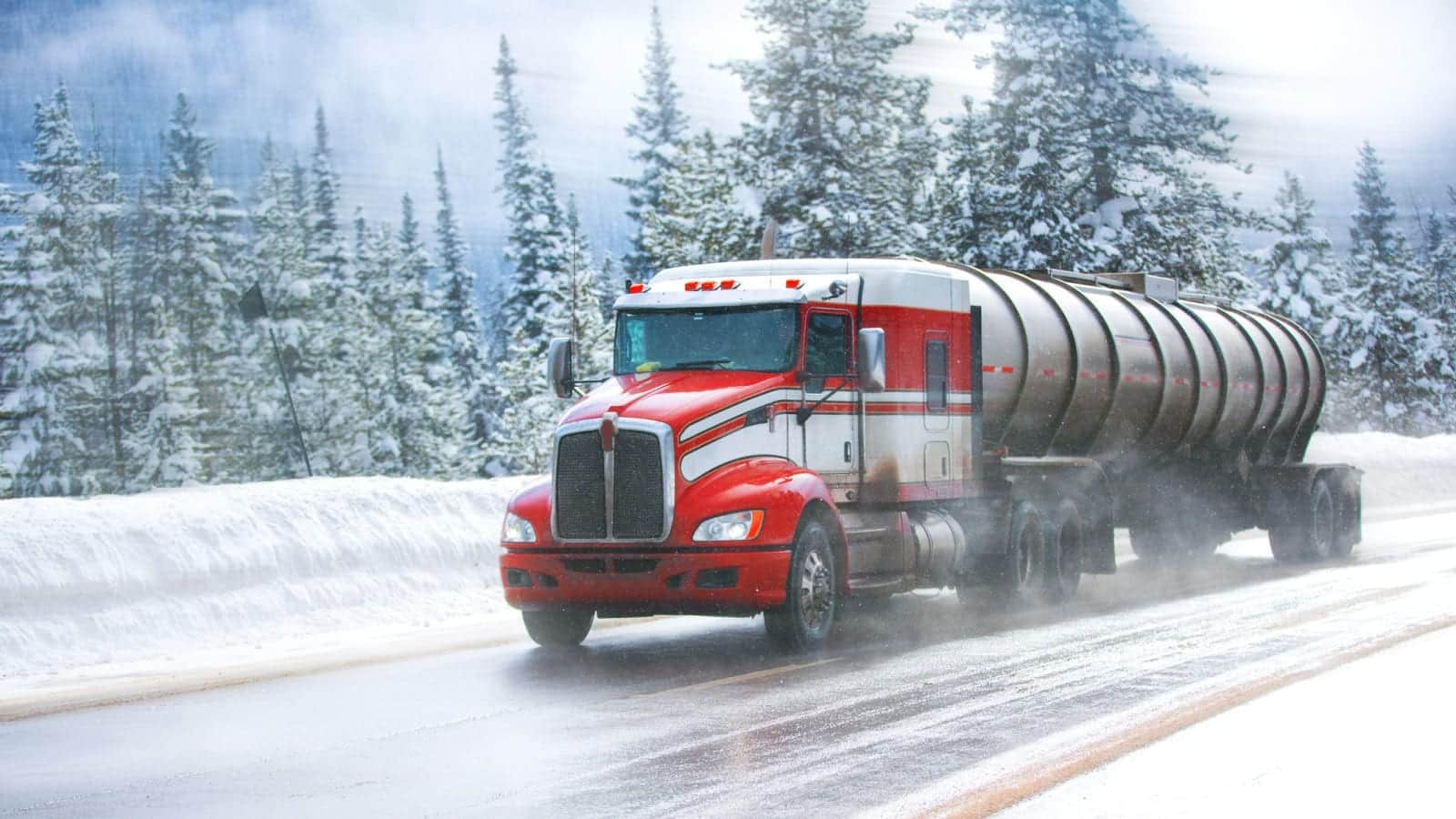 18-Wheeler Truck Driving In The Snow Stock Photo