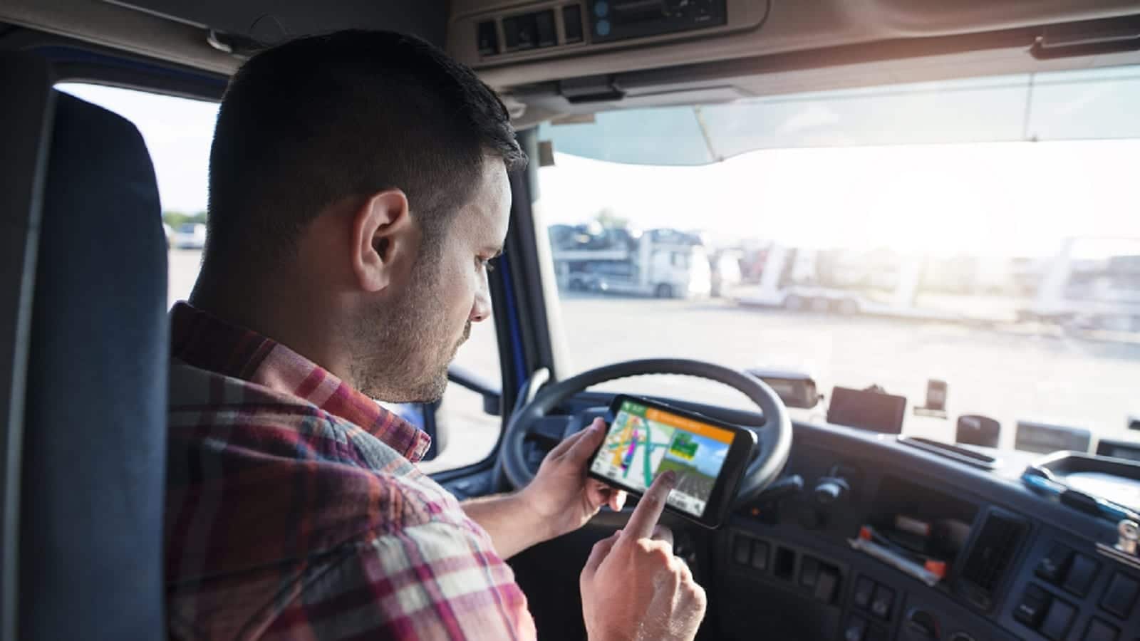 Truck Driver Using GPS System In Cab